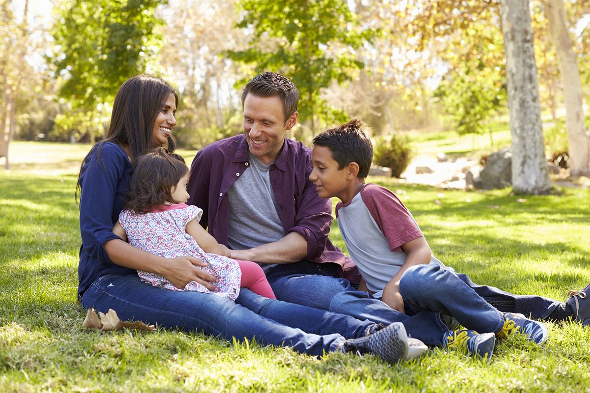 Family talking in park