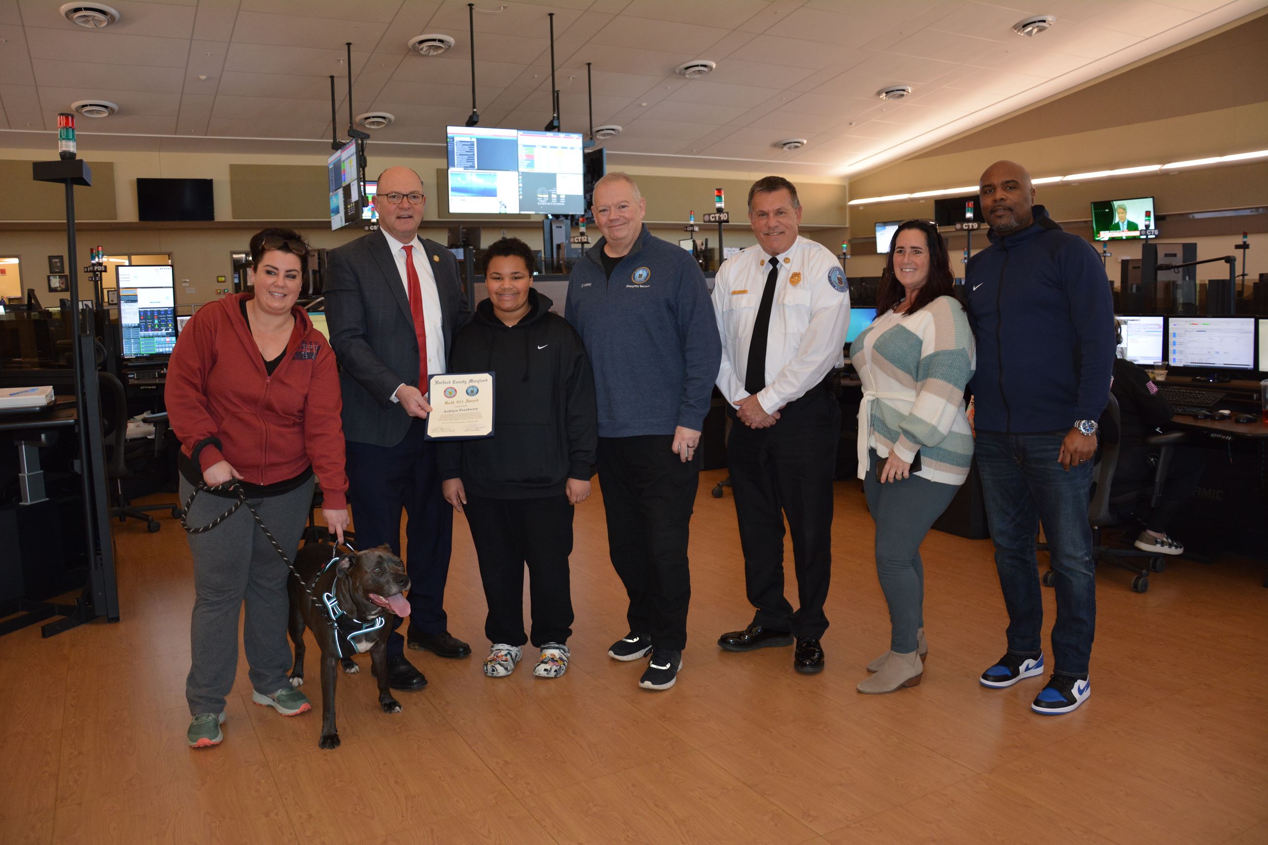 Ashtyn Presberry, 11, is presented with a Gold 9-1-1 Award pin